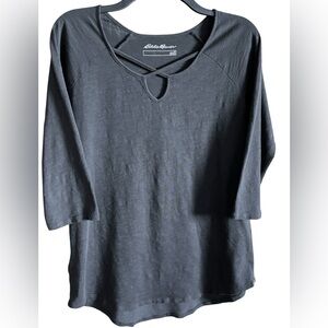 Women's size medium Eddie Bauer 3/4-sleeve cross-front tunic in black.